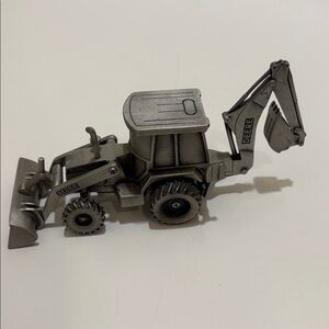 Spec Cast pewter John Deere model 310SE tractor.  No packaging.